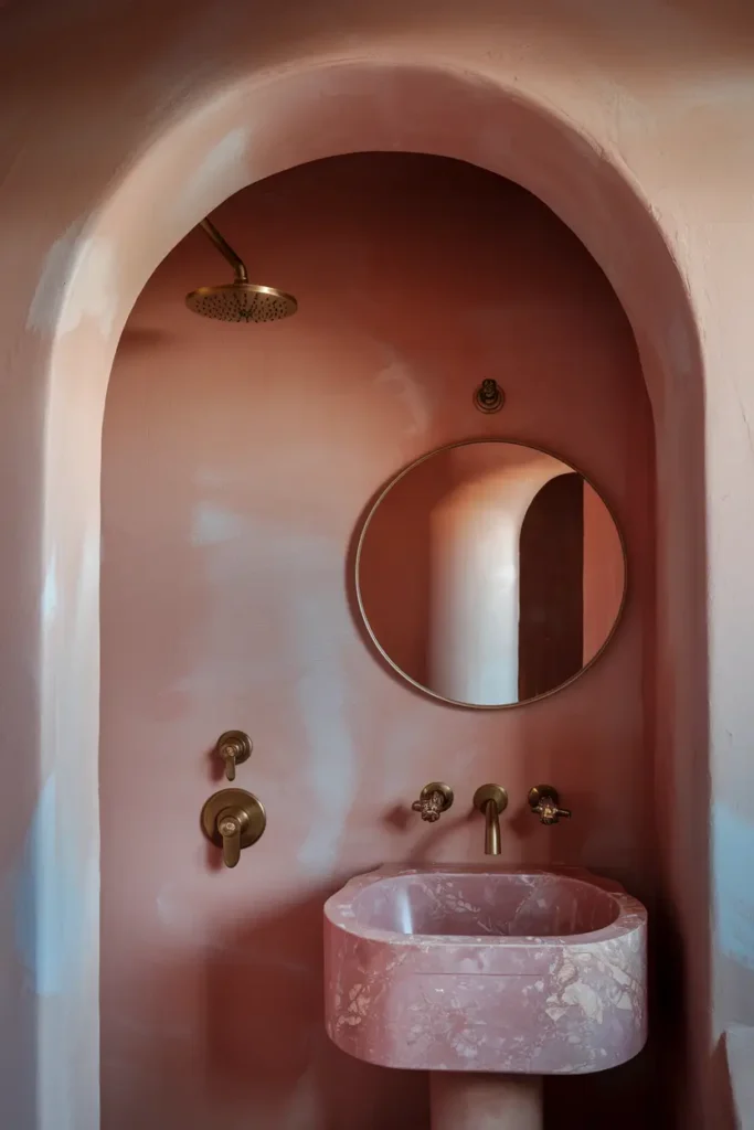 blush pink bathroom round mirror brass shower