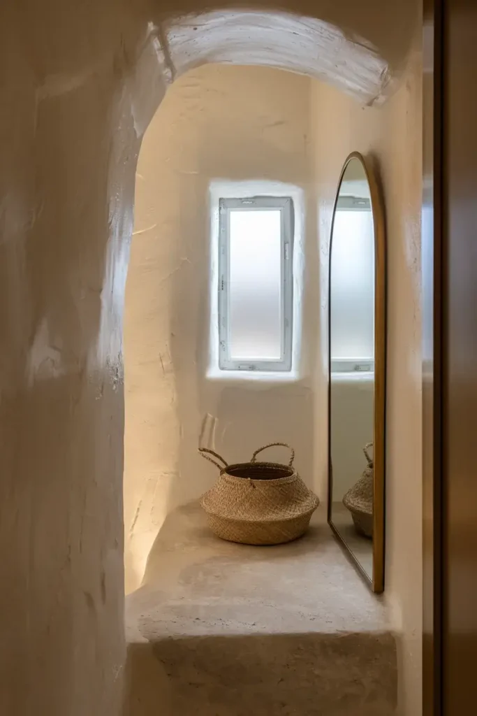 small bathroom arched mirror natural light nook