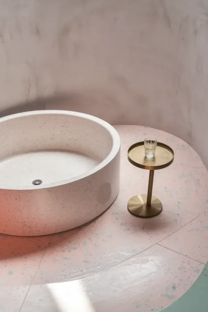 terrazzo floor bathroom round tub pastel flecks